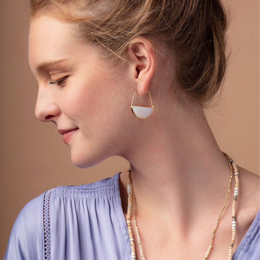 Scout Stone Prism Hoop earrings in opalite and gold worn by model