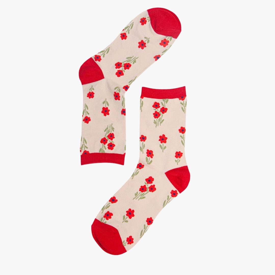 Cream bamboo ankle socks with red poppy floral pattern and red heel, toe, and cuff