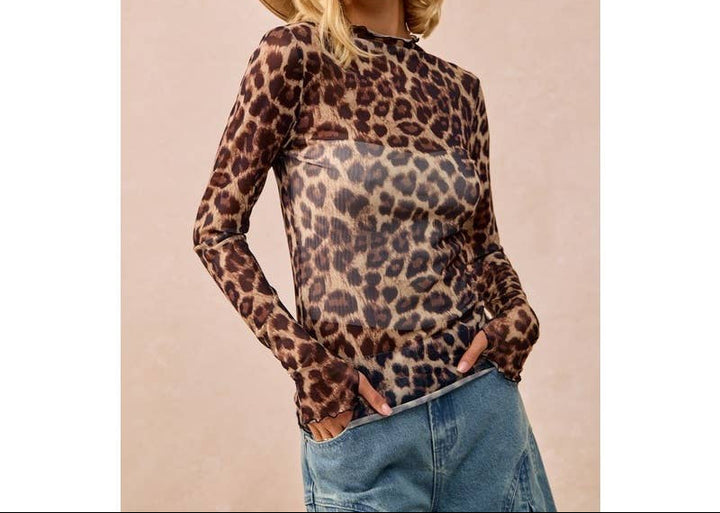 Woman wearing leopard print mesh long sleeve top with brown cowboy hat