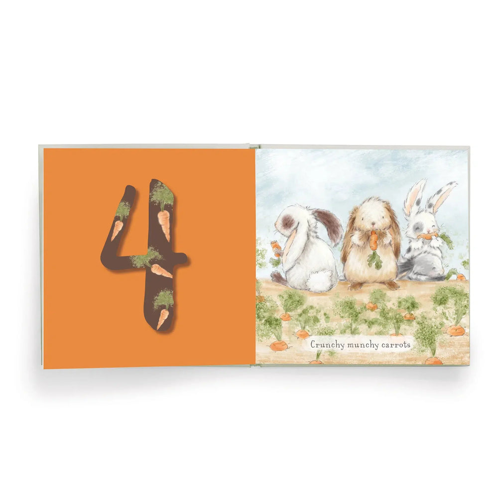Bunnies by the Bay Hares Play counting book open to page four with bunnies eating carrots