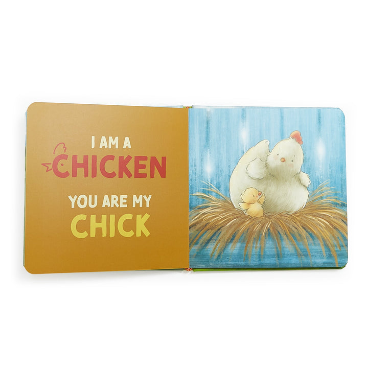 Open board book showing 'I Am A Chicken, You Are My Chick' with illustrated mother hen and baby chick