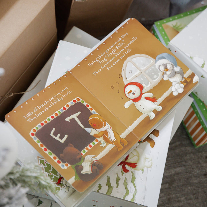Bunnies by the Bay Elf-A-Mentary School children's board book open showing holiday illustrations
