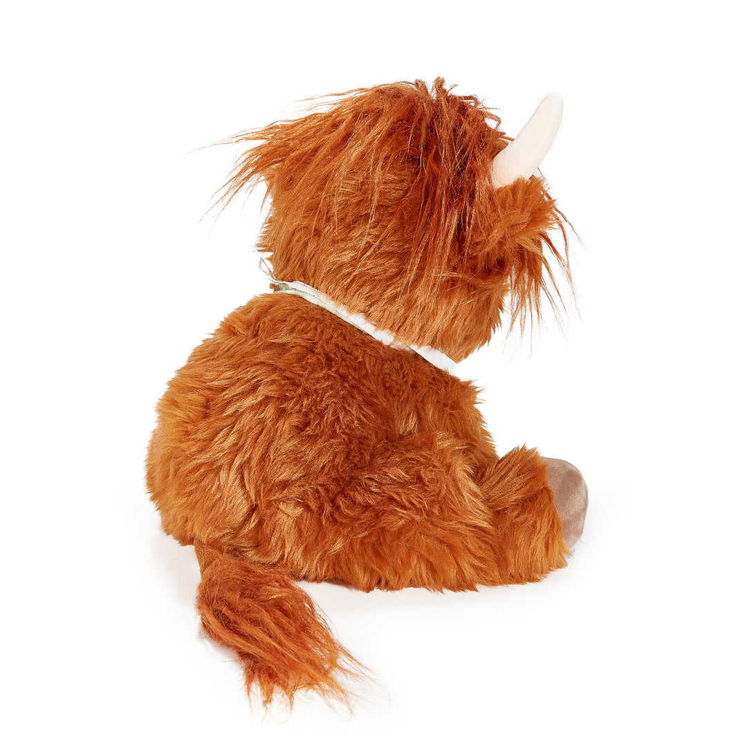 Back view of Hamish the Highland Cow plush toy with shaggy brown fur and cream horns