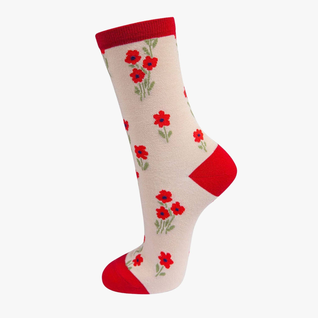 Cream bamboo ankle socks with red poppy floral pattern and red heel, toe, and cuff