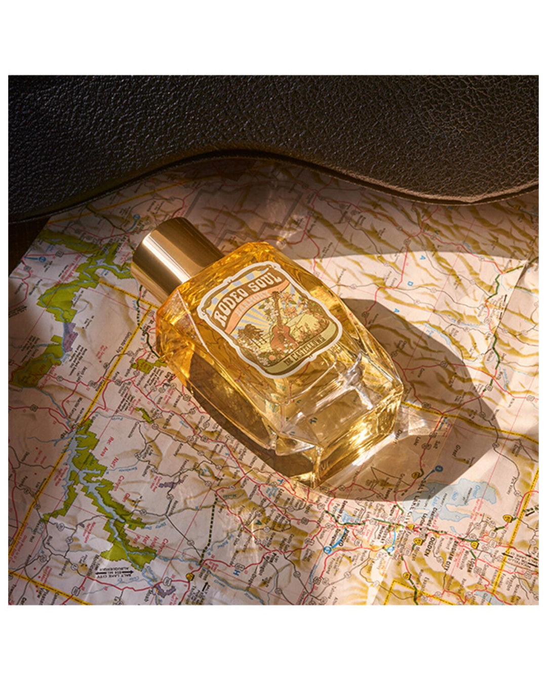 Rodeo Soul EDP 100ML Harmony by Tru Fragrance in golden amber bottle on vintage map
