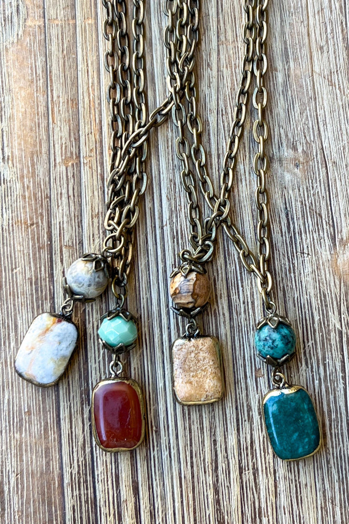 Bronze chain necklaces with gemstone beads and rectangular pendants in four color variations