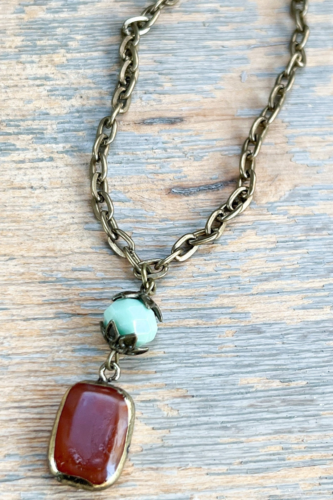 Dylan Jewelry Short Sicily Necklace with brass chain, turquoise bead, and carnelian pendant