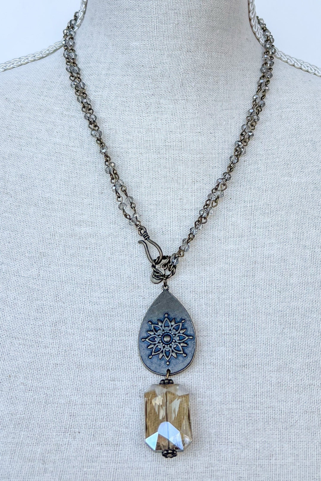 Bronze chain necklace with teardrop mandala pendant and faceted champagne crystal drop