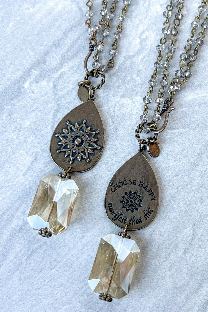Choose Happy bronze teardrop necklace with mandala design and clear crystal pendant, shown front and back