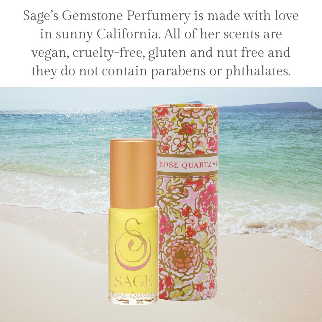 Sage Gemstone Perfumery Rose Quartz roller in yellow bottle with floral packaging on beach
