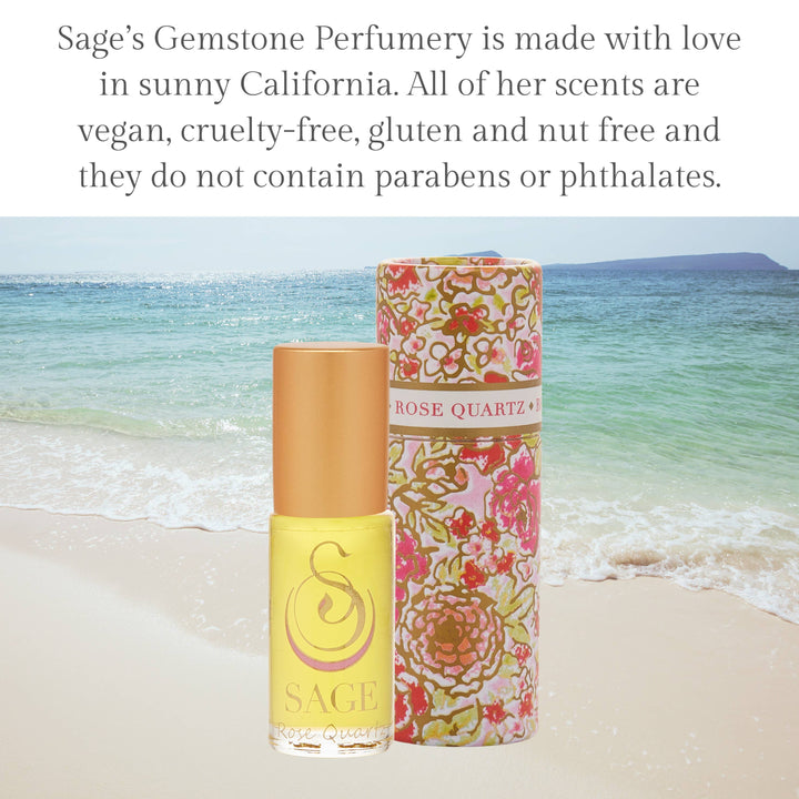 Sage Gemstone Perfumery Rose Quartz roller in yellow bottle with floral packaging on beach