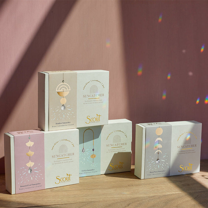 Scout Suncatcher collection display showing multiple moon phase and crystal pendant designs