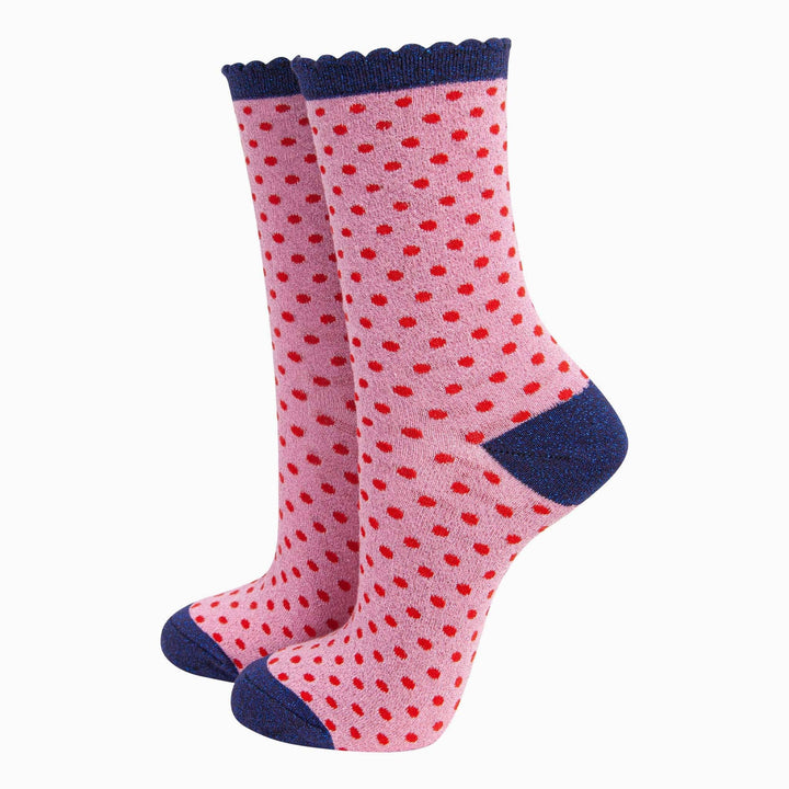 Pink polka dot ankle socks with red dots, navy scalloped cuff, heel and toe