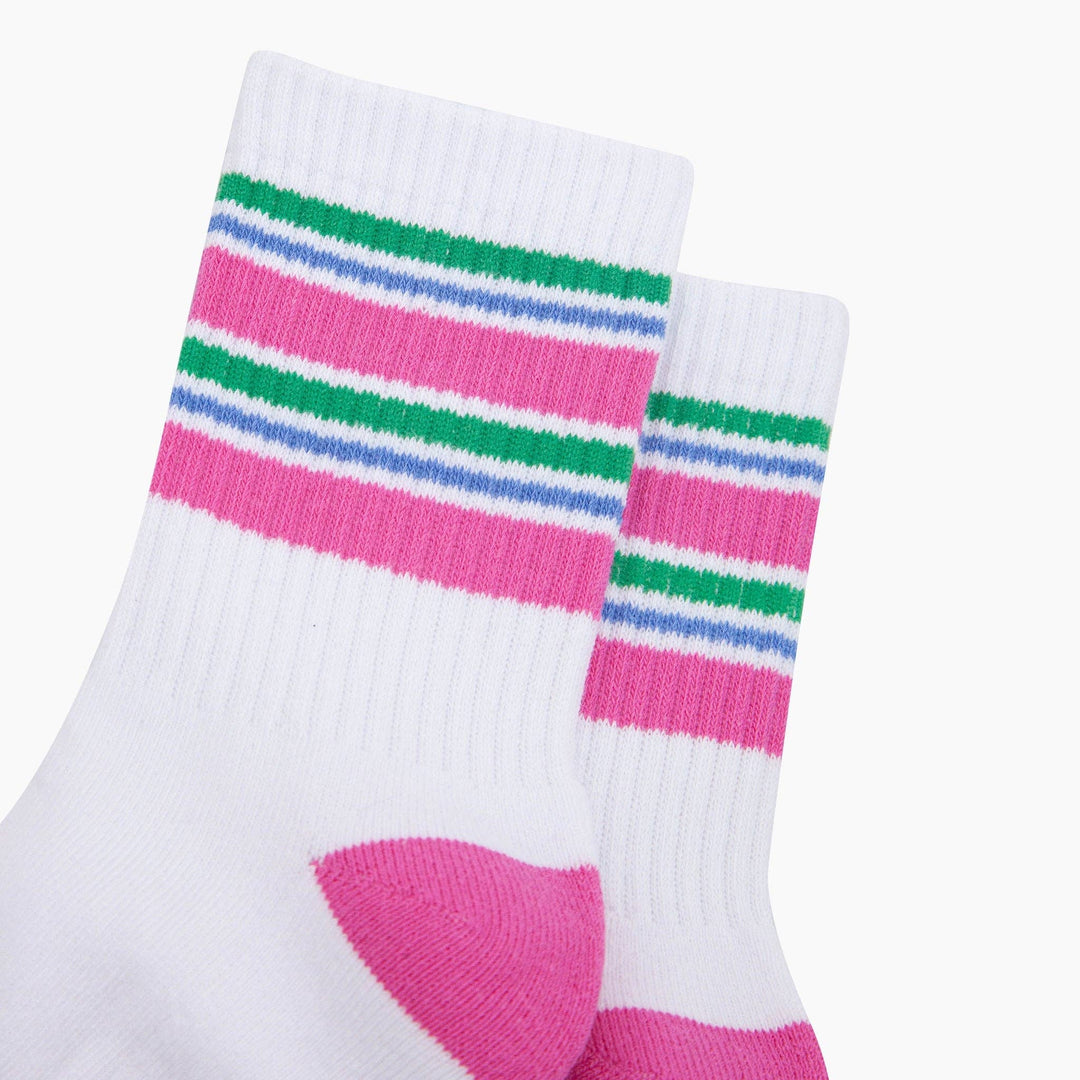 White ribbed crew sports socks with pink, green, and blue stripes and pink heel