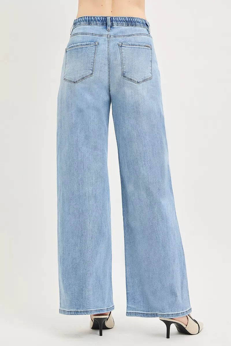Light blue wide leg jeans with drawstring waist and back pockets shown from behind
