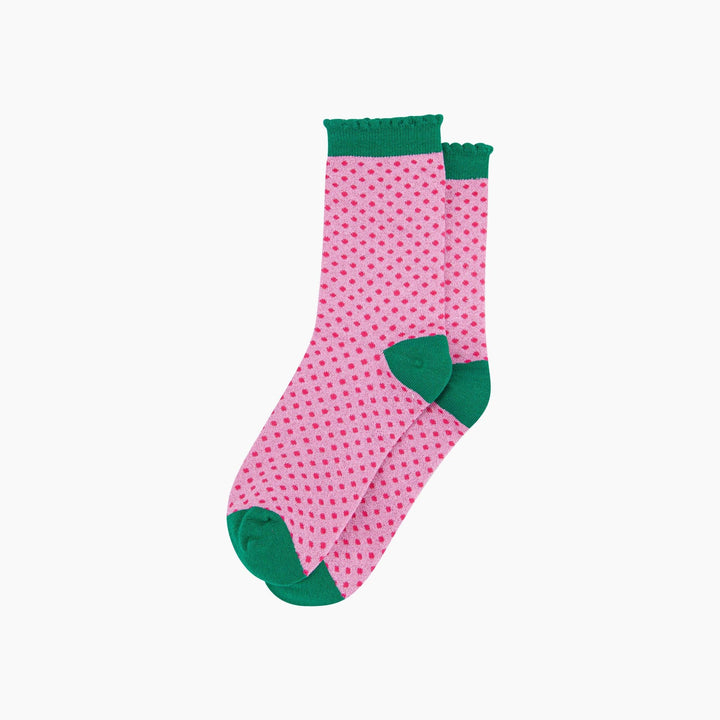 Pink glitter ankle socks with hot pink polka dots and green heel, toe, and frill cuff