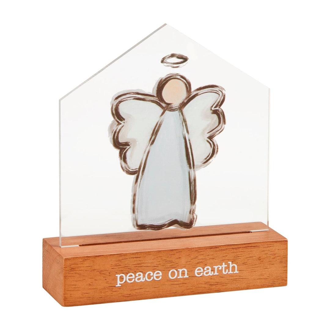 Clear acrylic angel ornament with brown outline on wooden base reading 'peace on earth'