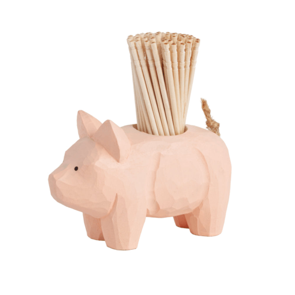 Pink wooden pig-shaped toothpick holder with wooden toothpicks displayed