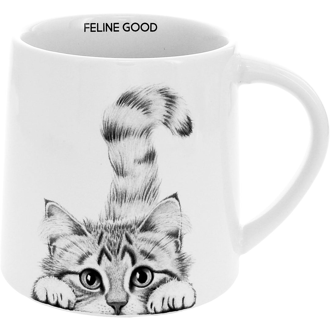 White 17 oz mug with cute cat illustration and 'Feline Good' text