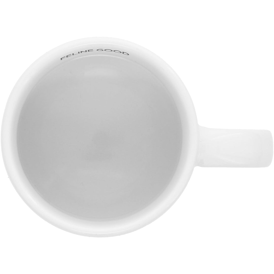 White ceramic mug with 'FELINE GOOD' text viewed from above showing interior