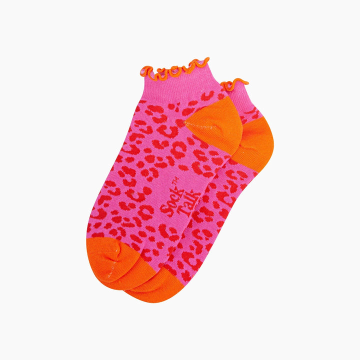 Pink leopard print ankle socks with orange toe, heel, and frilled cuff trim