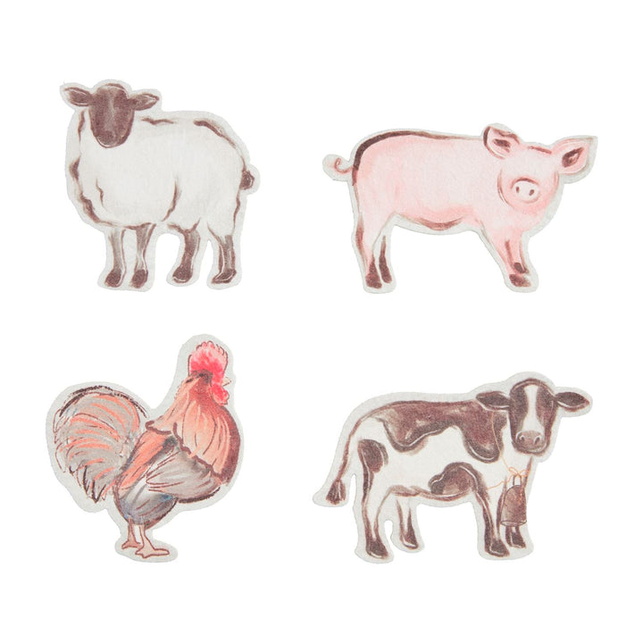 Four compressed farm animal sponges featuring sheep, pig, rooster, and cow designs