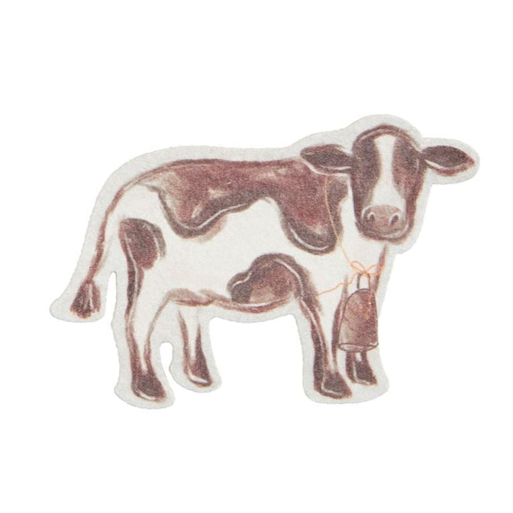 Brown and white spotted cow-shaped pop up sponge on white background