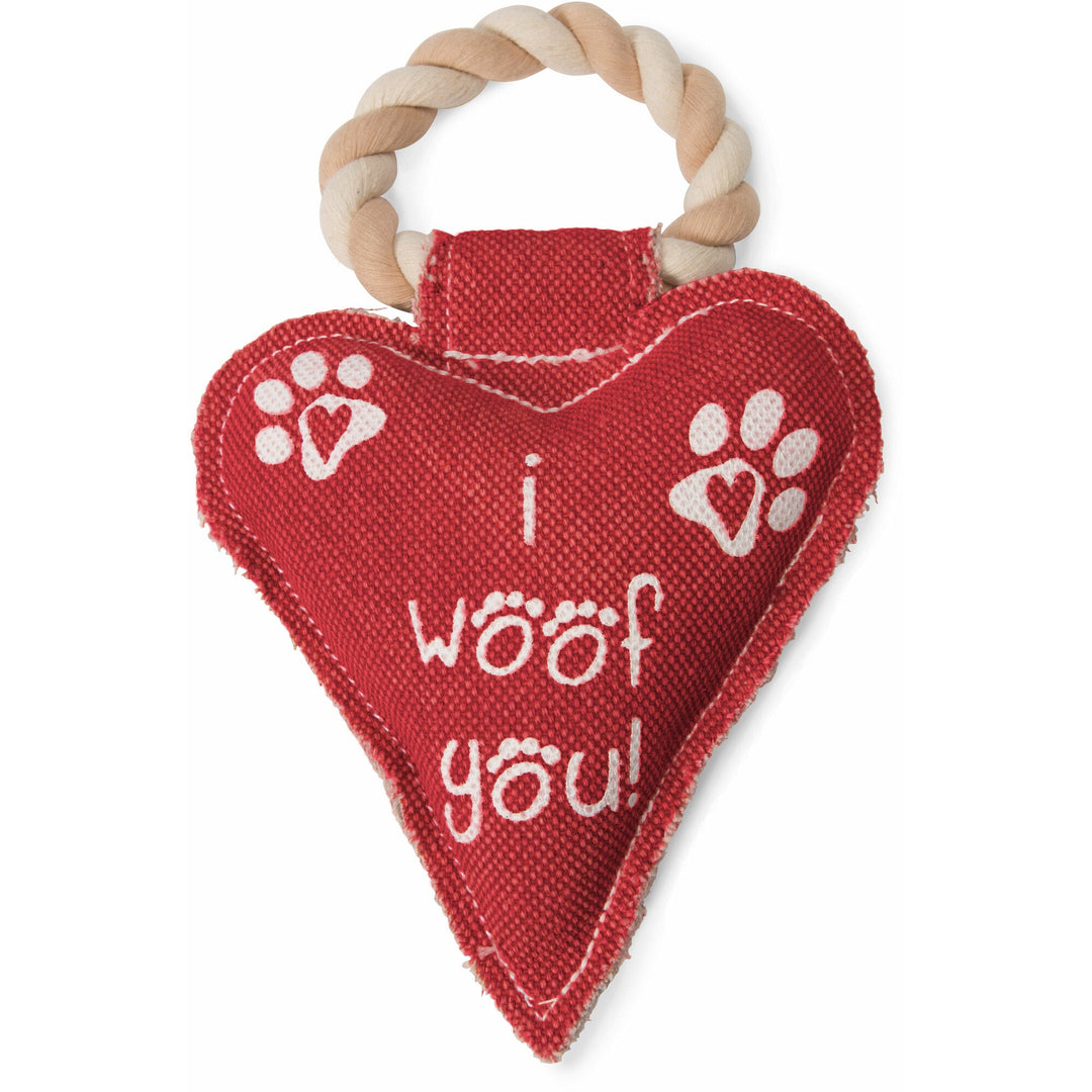 Red heart-shaped dog toy with rope handle featuring 'I woof you' text and paw prints