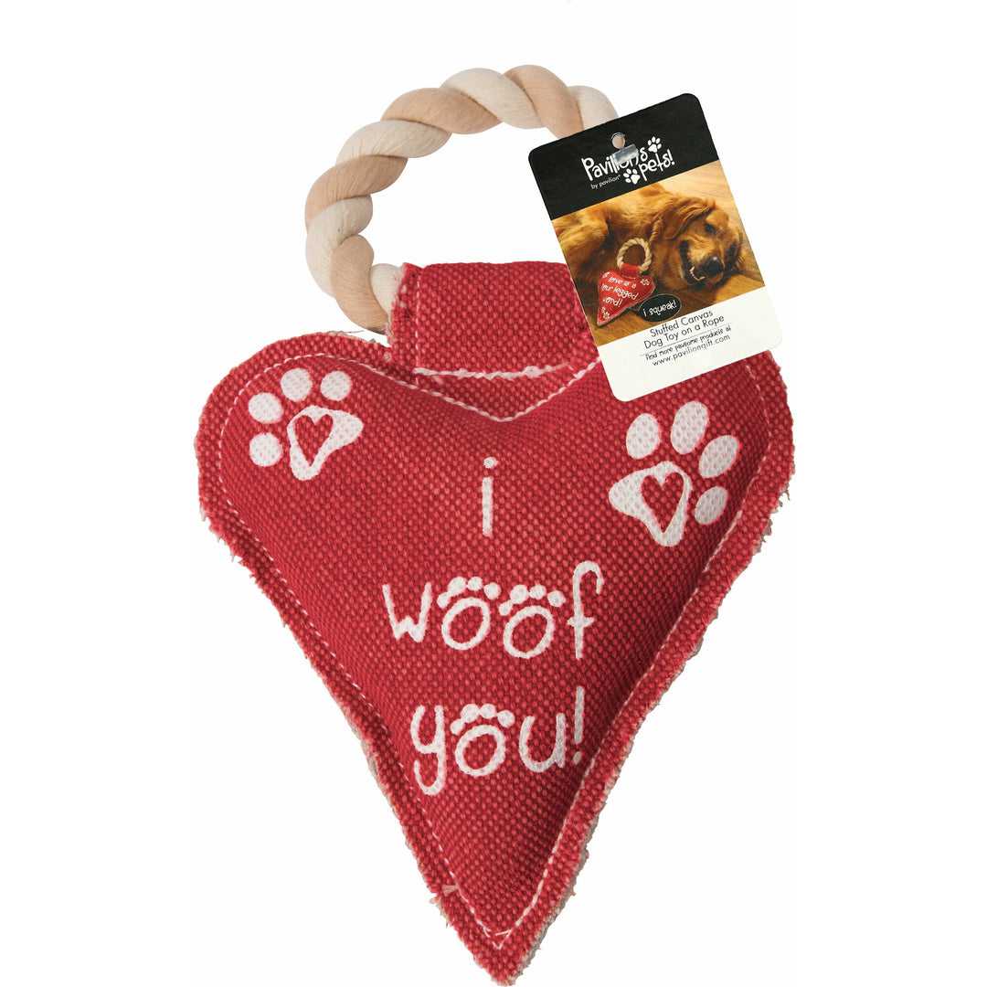 Red heart-shaped dog toy with rope handle featuring white paw prints and 'I woof you!' text