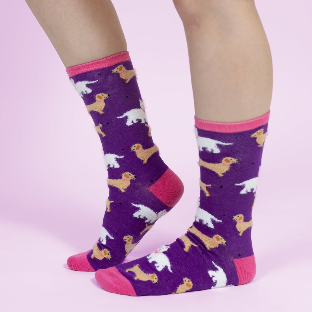 Purple unisex socks featuring small dog pattern with pink toe and heel accents
