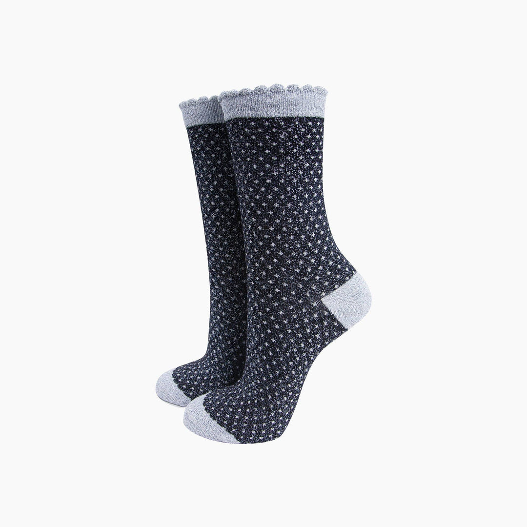 Navy blue glitter polka dot crew socks with gray scalloped cuff and heel