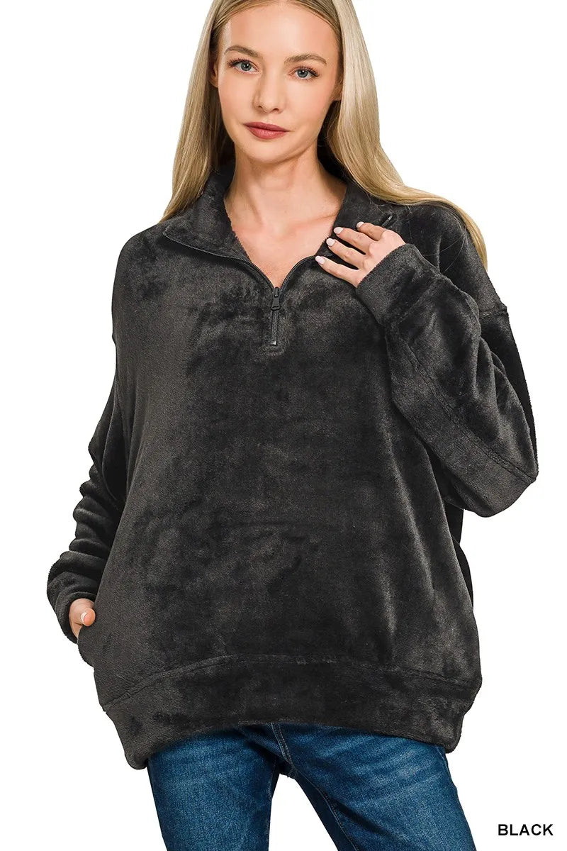 Woman wearing black faux fur half zip pullover sweatshirt by Zenana