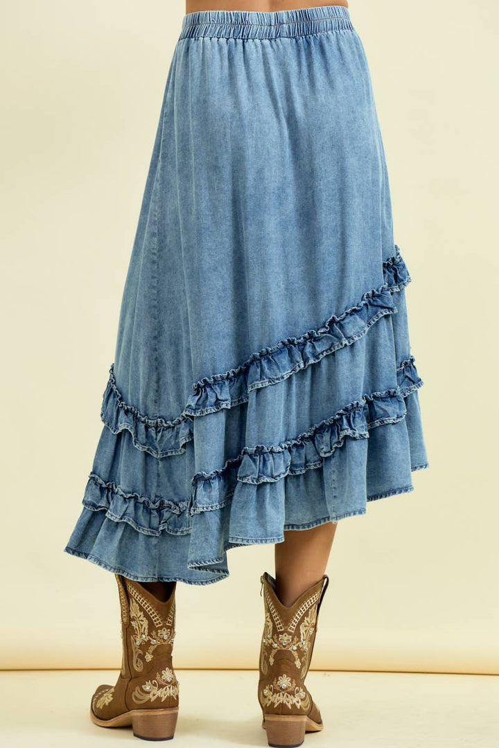 Light blue denim asymmetrical ruffle midi skirt with tiered fringe details