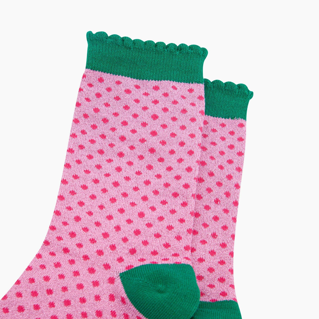 Pink glitter ankle socks with hot pink polka dots and green scalloped cuffs and heel