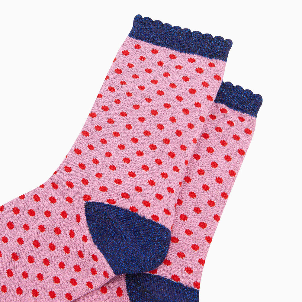 Pink cotton ankle socks with red polka dots and navy blue glitter cuffs and heel