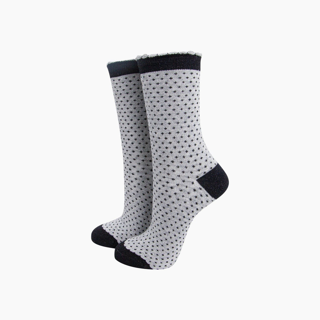 Grey and black polka dot glitter crew socks with black cuff, heel, and toe