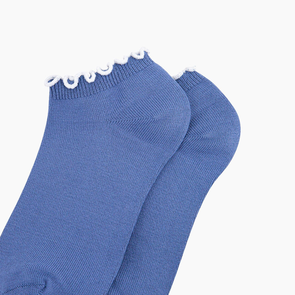 Blue bamboo trainer socks with decorative white frilly trim at the cuff