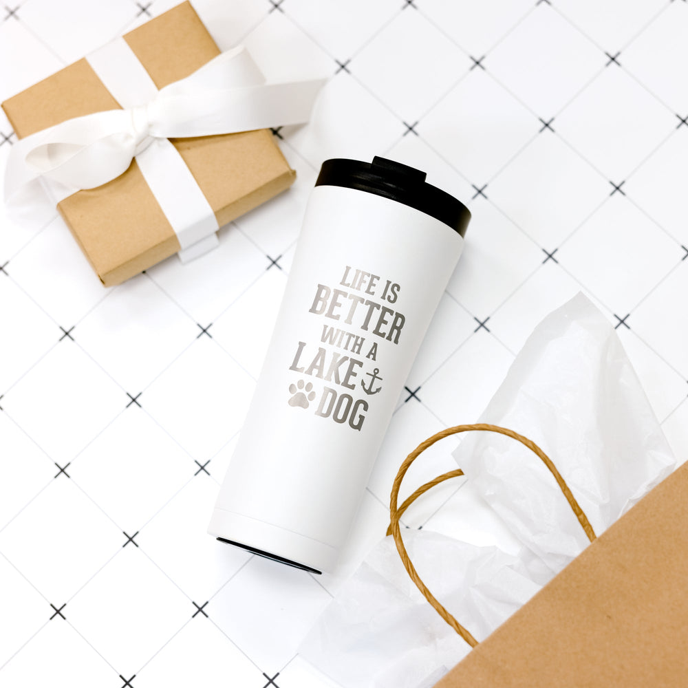 White stainless steel travel tumbler with 'Life is Better with a Lake & Dog' text