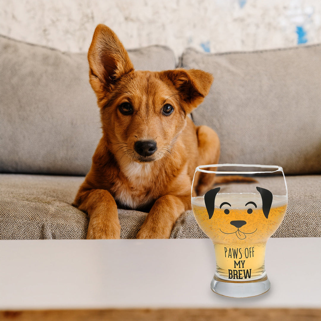 Clear pilsner glass with dog face design and 'Paws Off My Brew' text, filled with beer