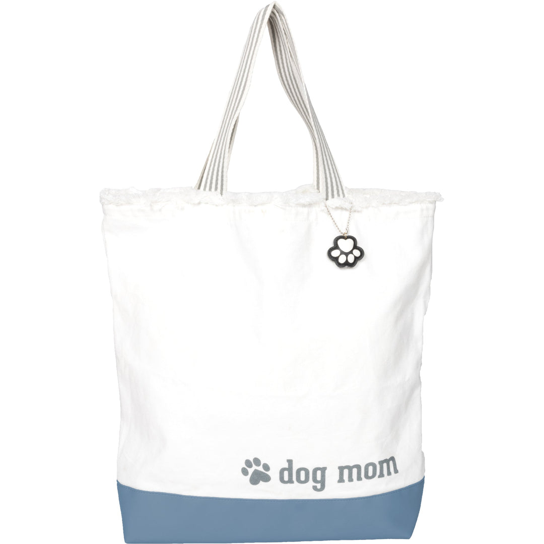 White canvas tote bag with blue bottom, 'dog mom' text and paw print charm