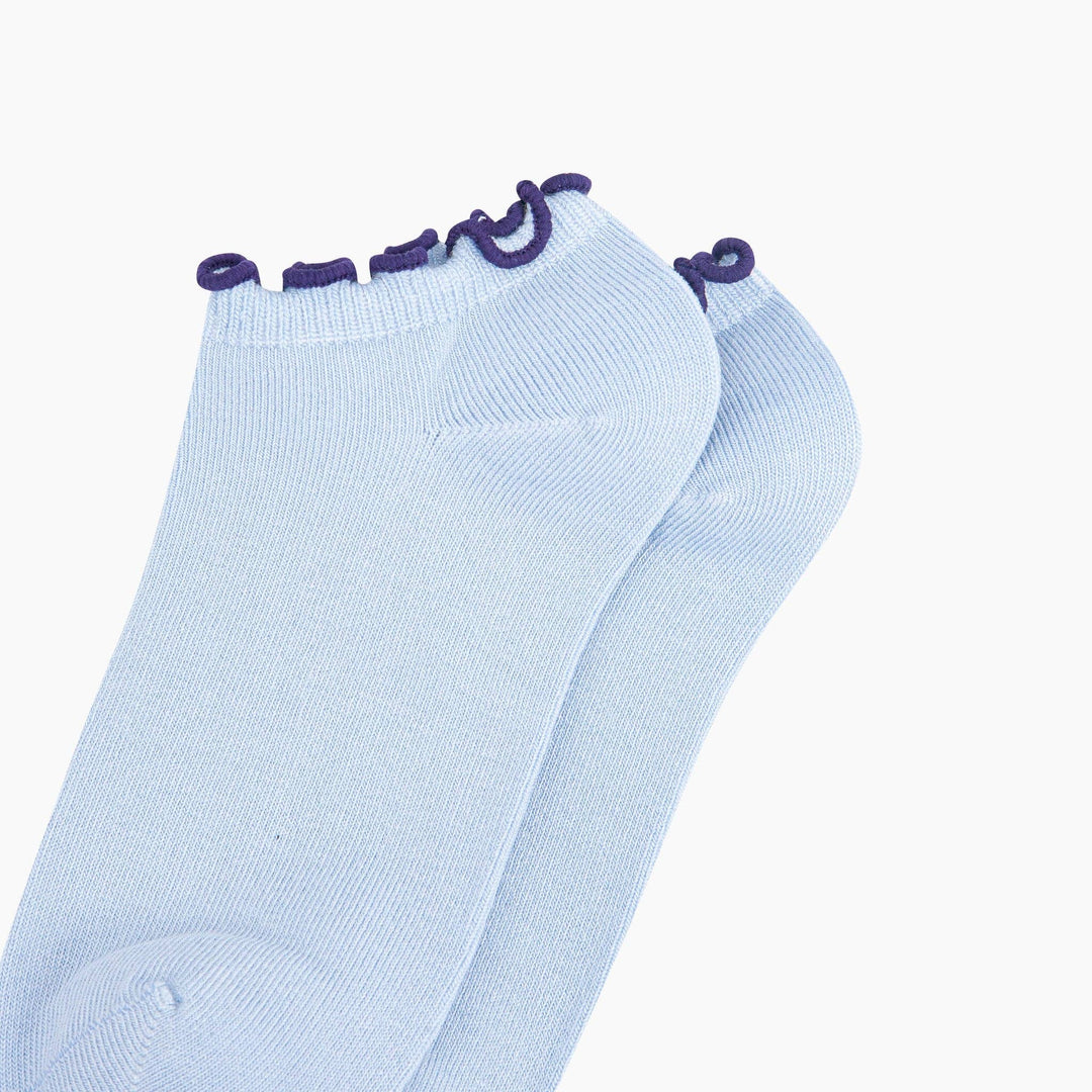 Light blue bamboo trainer socks with decorative navy frilly trim at the ankle
