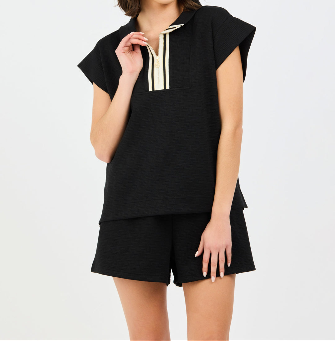 Black Porter set featuring hooded sleeveless top with cream drawstrings and matching shorts
