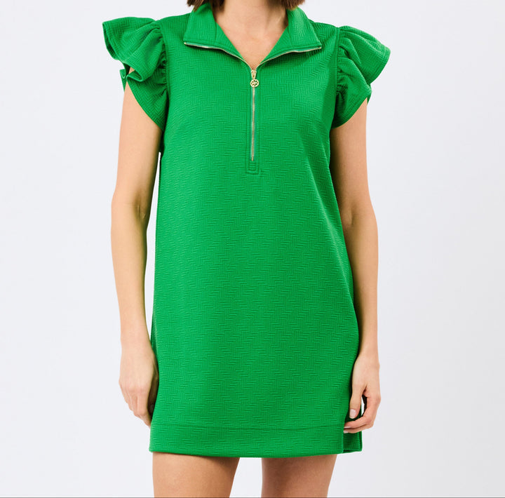 Woman wearing bright green zip-front dress with ruffle cap sleeves