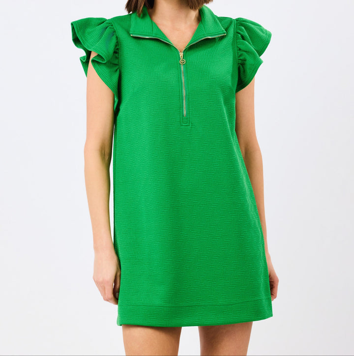 Woman wearing bright green zip-front dress with ruffle cap sleeves