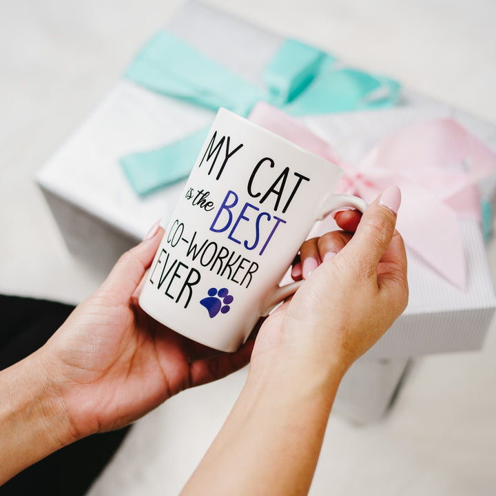 White ceramic mug with 'My Cat is the Best Co-Worker Ever' text and paw print