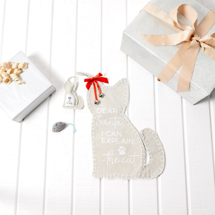 Light gray canvas Christmas stocking with cat-themed text and small mouse toy attachment