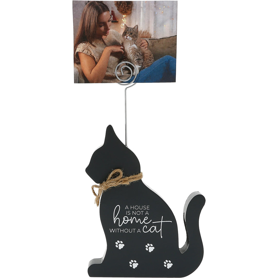 Black cat-shaped plaque with photo clip and inspirational text about home and cats
