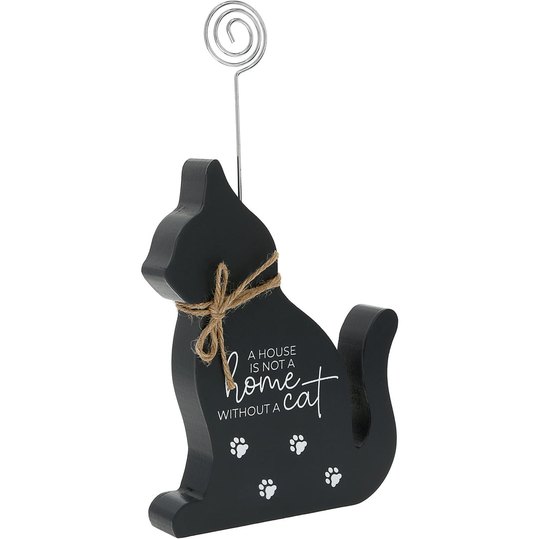 Black cat-shaped plaque with photo clip and inspirational text about home and cats