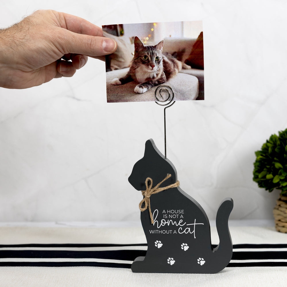 Dark gray cat-shaped photo clip holder with inspirational text and paw prints