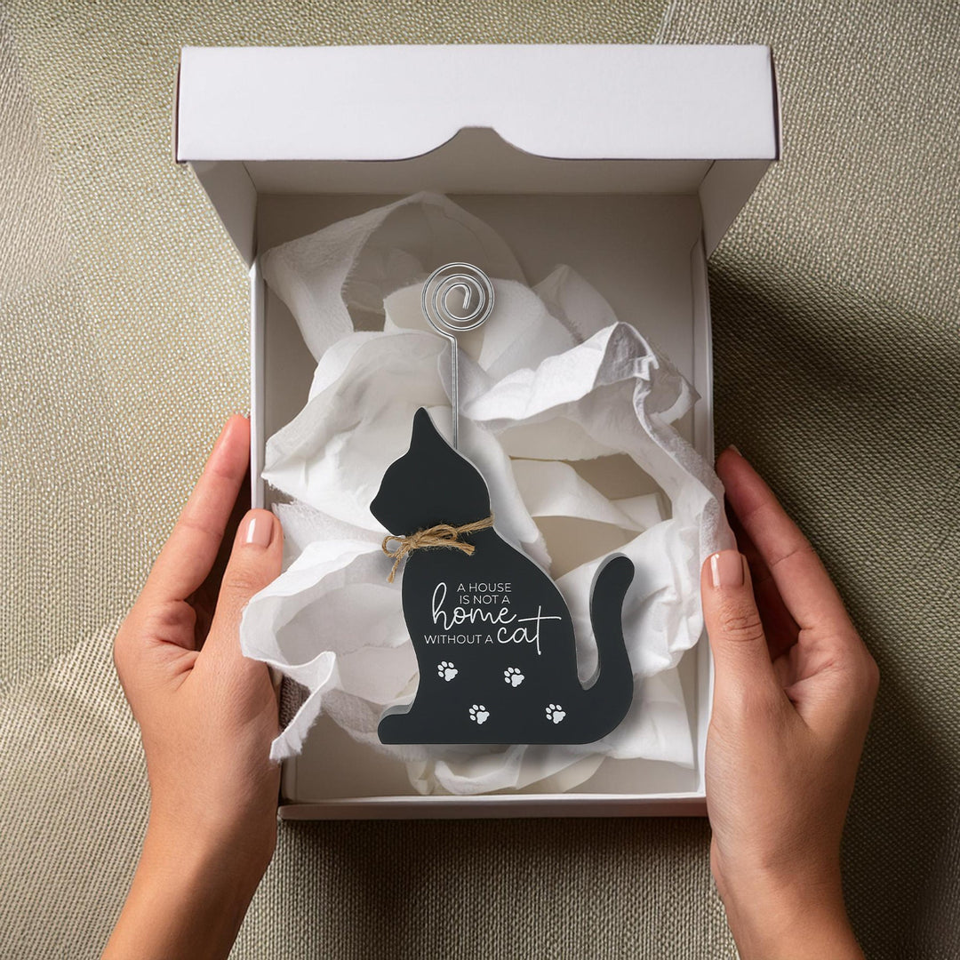 Black cat-shaped plaque with wire photo clip and paw prints in gift box